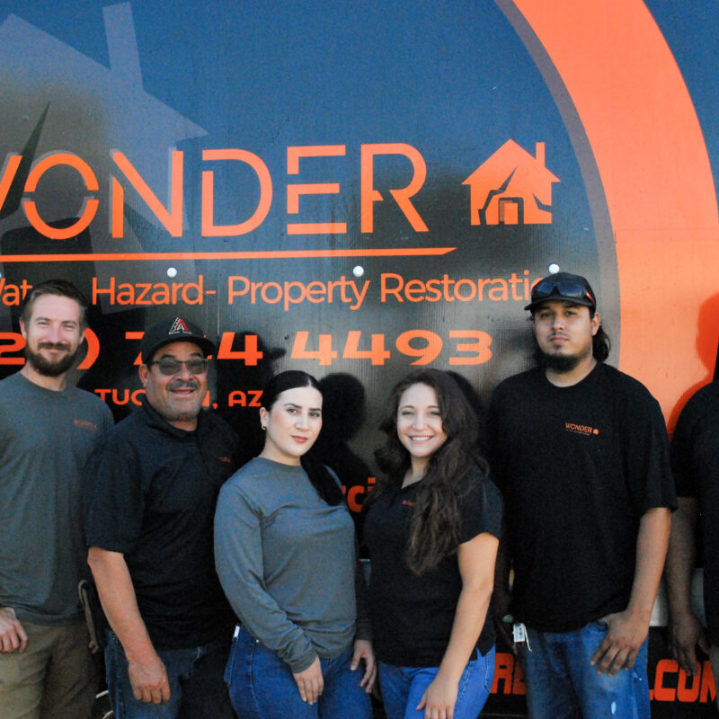 wonder restoration team in front of truck